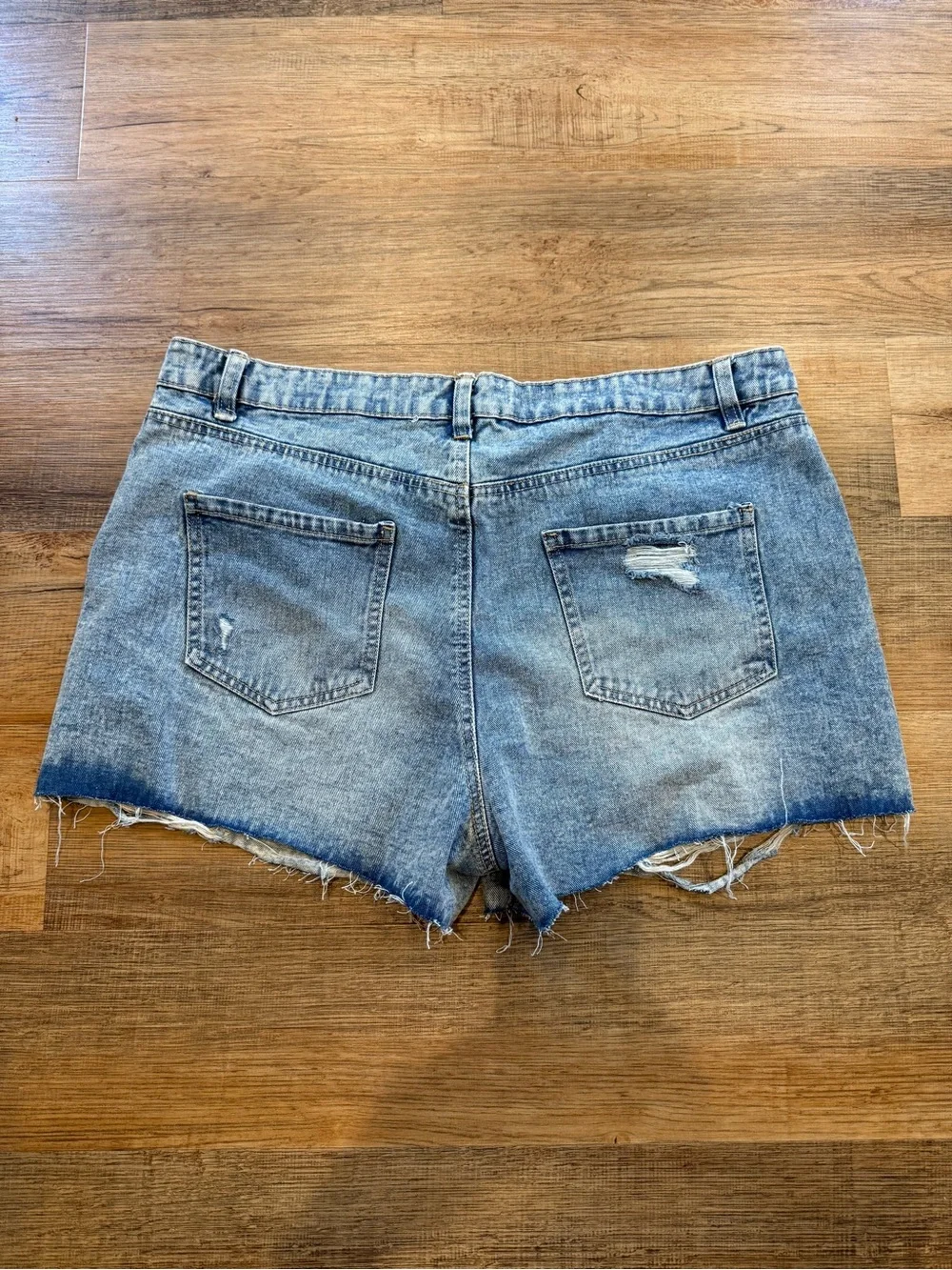 refuge light wash distressed denim cutoff shorts